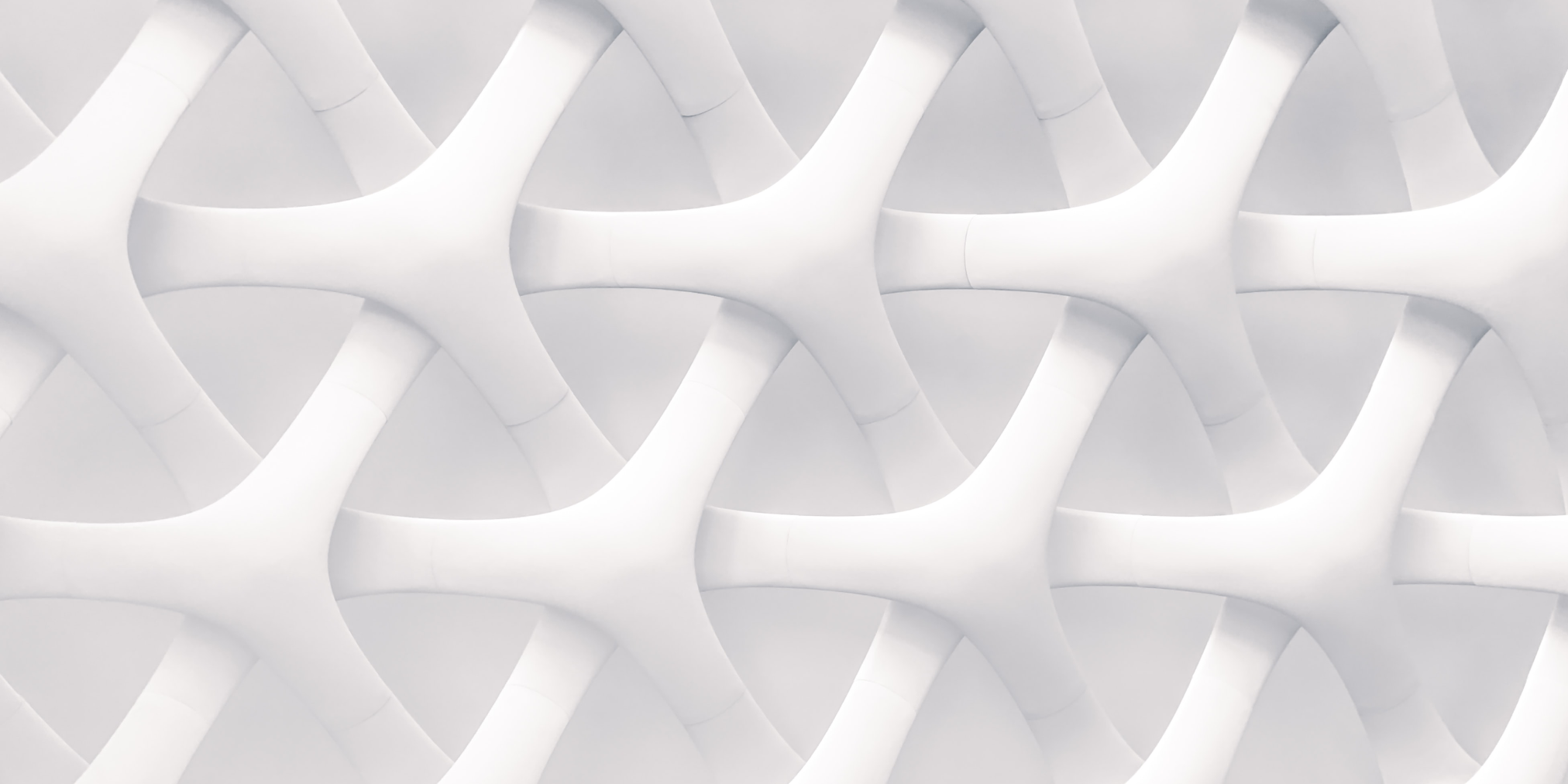 Interconnected white geometric forms